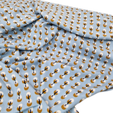 Viskose hellblau mit senfgelben Kreisen